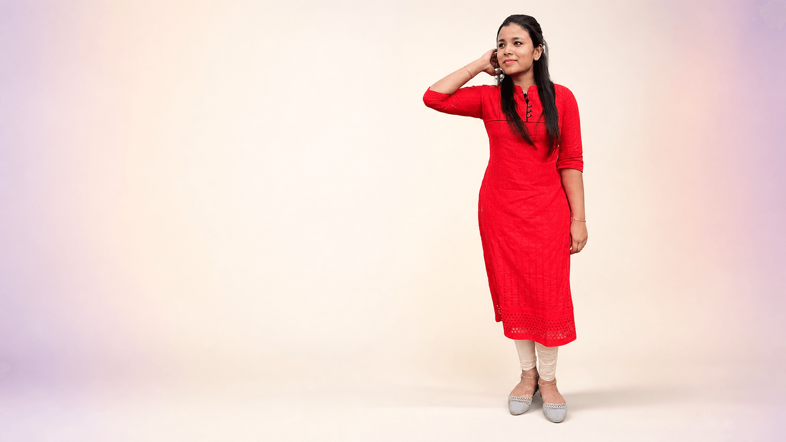 Woman wearing a red embroidered kurta from DZANE