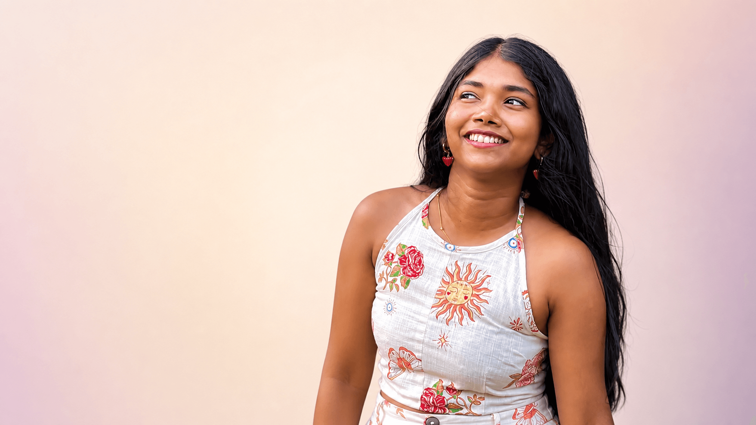 Woman wearing a white floral co-ord set from DZANE